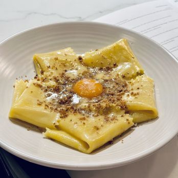 Bancone signature dishes Silk Handkerchiefs with Walnut Butter and Confit Egg YolkSpicy Pork and N'duja RaguBucatini Cacio e Pepe